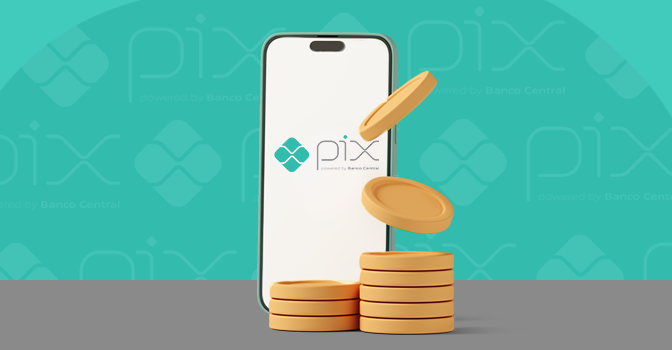 Imagem mostra uma moedas à frente de um smartphone aberto no Pix